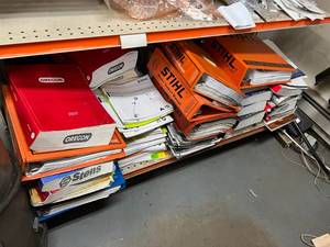 lot 139 image: Shelf Full of Manuals and Catalogs