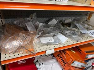 lot 140 image: Shelf Full of Stihl Supplies