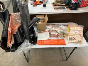 lot 148 image: Table Full of Stihl Parts