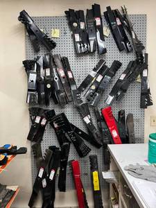 lot 149 image: Wall of New Lawn Mower Blades