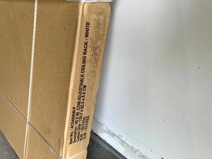 lot 83 image: Husky Adjustable Height Overhead Ceiling Mount Garage Rack in White (42 in. H x 96 in. W x 48 in. D)