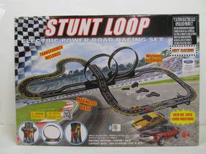 lot 12 image: New in Box Large Stunt Loop Slot Car Racing Set