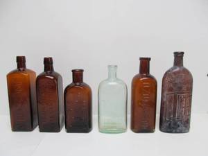 lot 125 image: Nice Group of Early Antique Embossed Glass Advertising Bottles