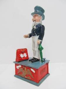 lot 167 image: Cast Iron UNCLE SAM Mechanical Coin Bank