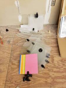 Pile of Sign Displays and Display Clamp