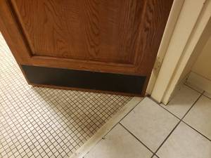 Restroom Door with Decorative M Sticker