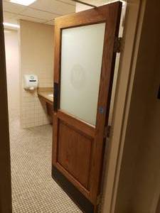 Restroom Door with Decorative W Sticker