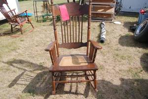 lot 256 image: Rocking chair with tan wicker seat...