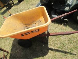 lot 133 image: 3 cubic foot True temper poly wheel...