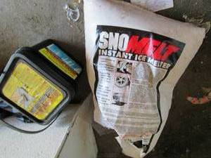 lot 157 image: Over half bag of snow melt and a bu...