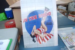 lot 47 image: Metal picture brunette with beach t...