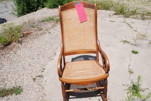 lot 63 image: Tan wicker rocking chair...