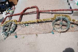 lot 85 image: Red and gold Christmas truck. 8ft x 4ft Not t...