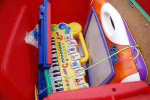 lot 451 image: (1) Tote and (1) Box of toys rangin...