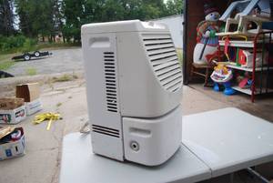 lot 485 image: Vintage metal space heater on wheel...