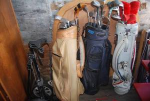 lot 542 image: 3 sets of golf clubs and a caddy...