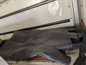 lot 111 image: Unused leftover roll of roofing rub...