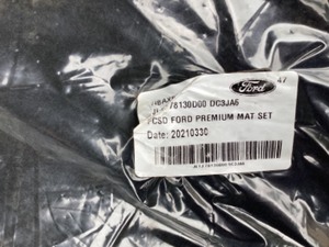 Brand new Ford floor mats and 2 rubber floor mats