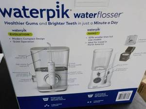 lot 33 image: WaterPik Water Flosser...