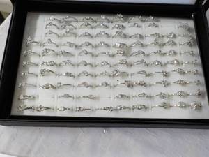 lot 66 image: 92 Zirconia Rings in a Display Case...