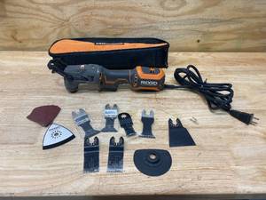 lot 64 image: RIDGID R2851- Series B 4.0 Amp Multi-Tool with Accessories and Carrying Bag