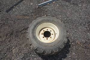 Firestone Dynafoam Skid Loader Tire on 8 Bolt Rim