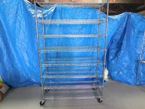 lot 16 image: Metal racking shelves on wheels