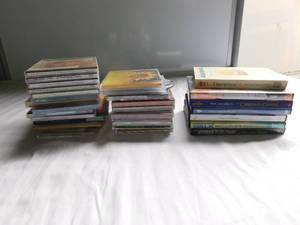 lot 18 image: 34 musical items - CDs, cassesttes & DVDs