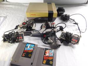 lot 117 image: Nintendo system, 4 contollers and 2 games
