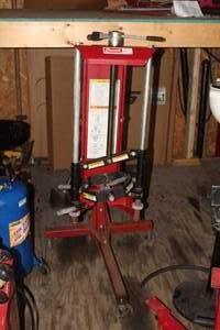 lot 7 image: Branick 7200 Strut Compressor with Rolling Stand