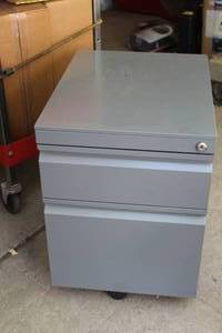 lot 128 image: Metal Rolling File Cabinet 2-drawer