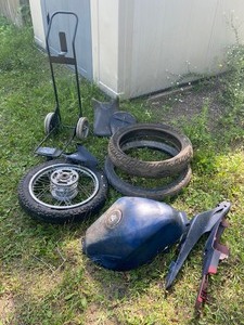 lot 52 image: Misc. Motorcycle Parts Plus.