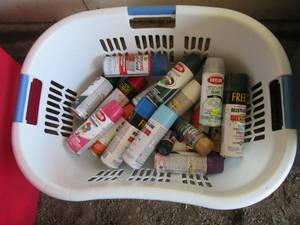 Laundry basket of spray paint cans...