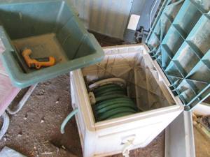 Suncast garden hose box with hose i...