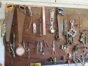 Garage wall board of tools includin...