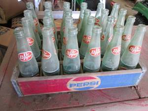 24 Dr Pepper bottles in a wood Peps...