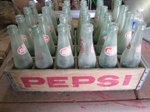 24 Dr Pepper bottles in a wood Peps...
