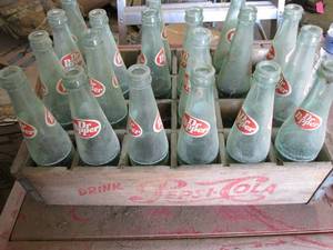 24 Dr Pepper bottles in a wood Peps...