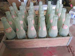 24 Dr Pepper bottles in a wood Peps...