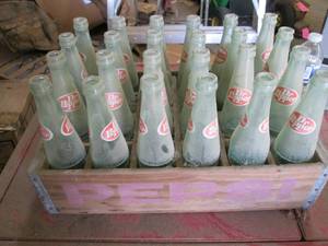 24 Dr Pepper bottles in a wood Peps...