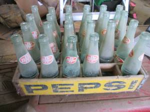 24 Dr Pepper bottles in a wood Peps...