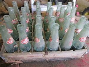 24 Dr Pepper bottles in a wood Peps...