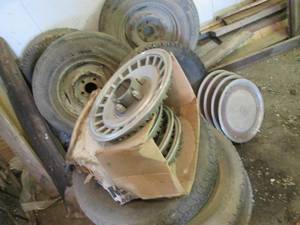 7 tires (most with rims) and 2 sets...