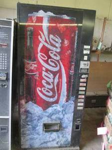 Coke machine uses can or 10 Oz bott...