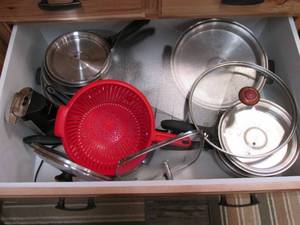 Contents of drawer including pots, ...