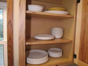 Contents of cupboard includes plate...