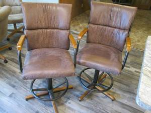 2 padded faux leather swiveling bar...