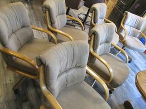 6 padded dining room chairs on whee...