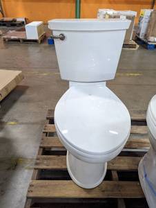 lot 536 image: Champion Tall Height 2-Piece High-Efficiency 1.28 GPF Single Flush Elongated Toilet in White Seat Included