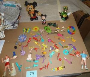 Group of vintage charms, costume jewelry and Mickey Mouse
